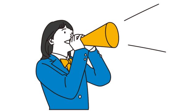 Female students cheering with a megaphone